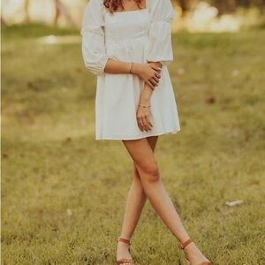Beautiful White Dress with Square Neck and Puff Sleeves.